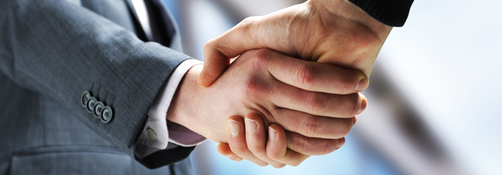 Pain-Relief-Cedar-Rapids-IA-Business-People-Shaking-Hands-at-a-Proposal.jpg low back pain relief with chiropractic care